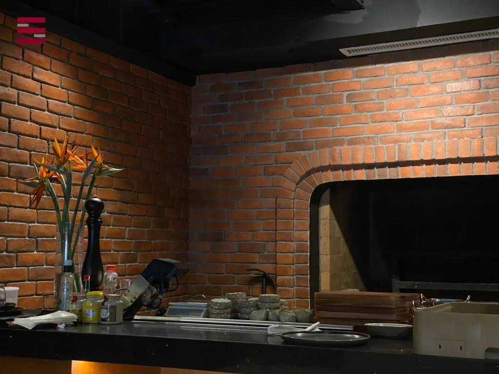 Classic Brick interior cladding with arched oven – rustic kitchen feature wall in restaurant setting